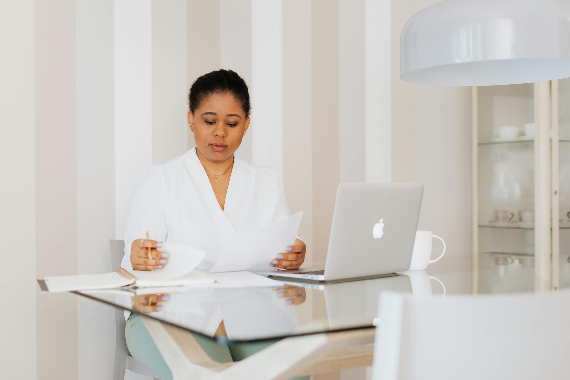 woman checking files in her office