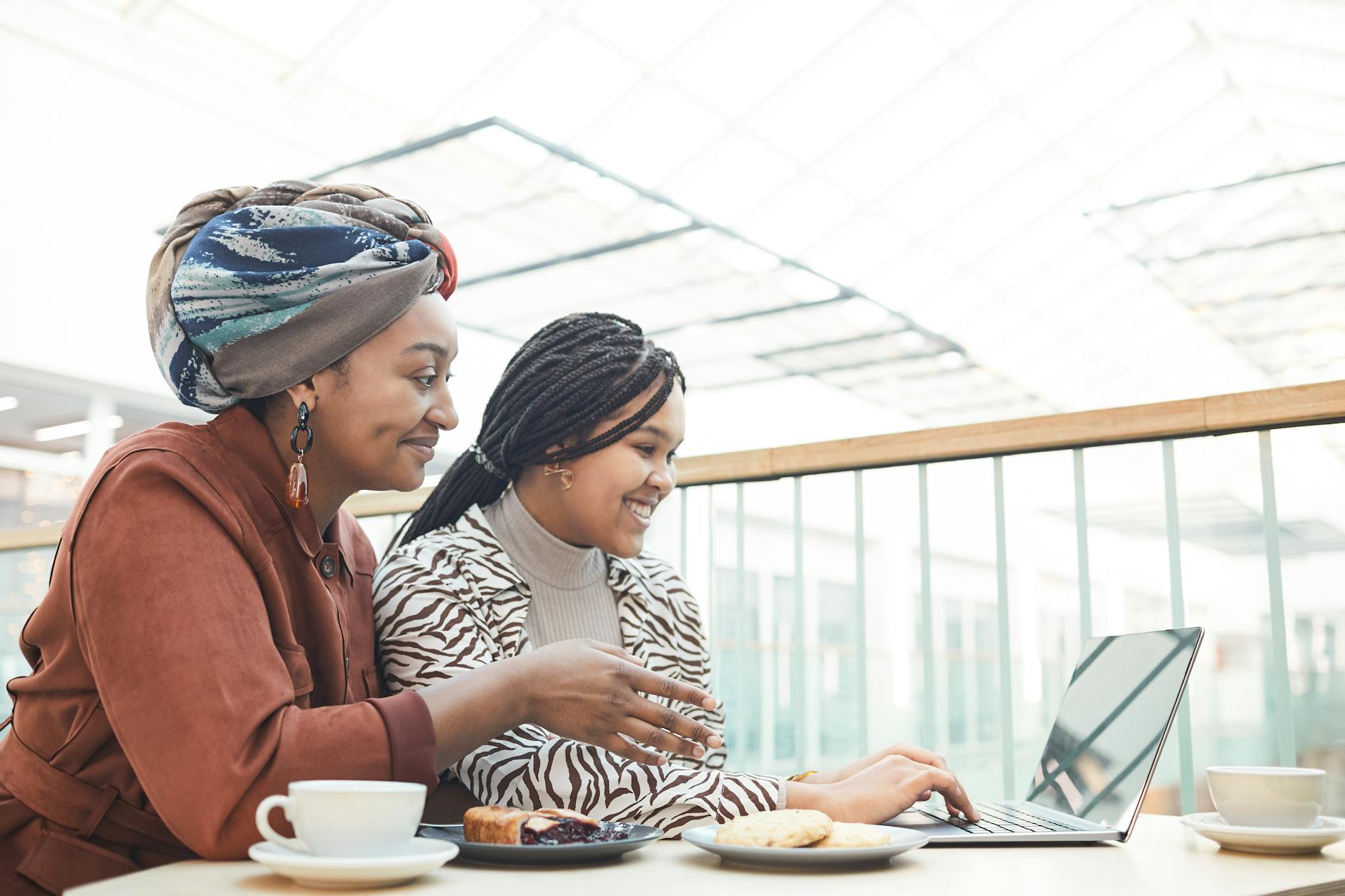 women using a laptop while having a break