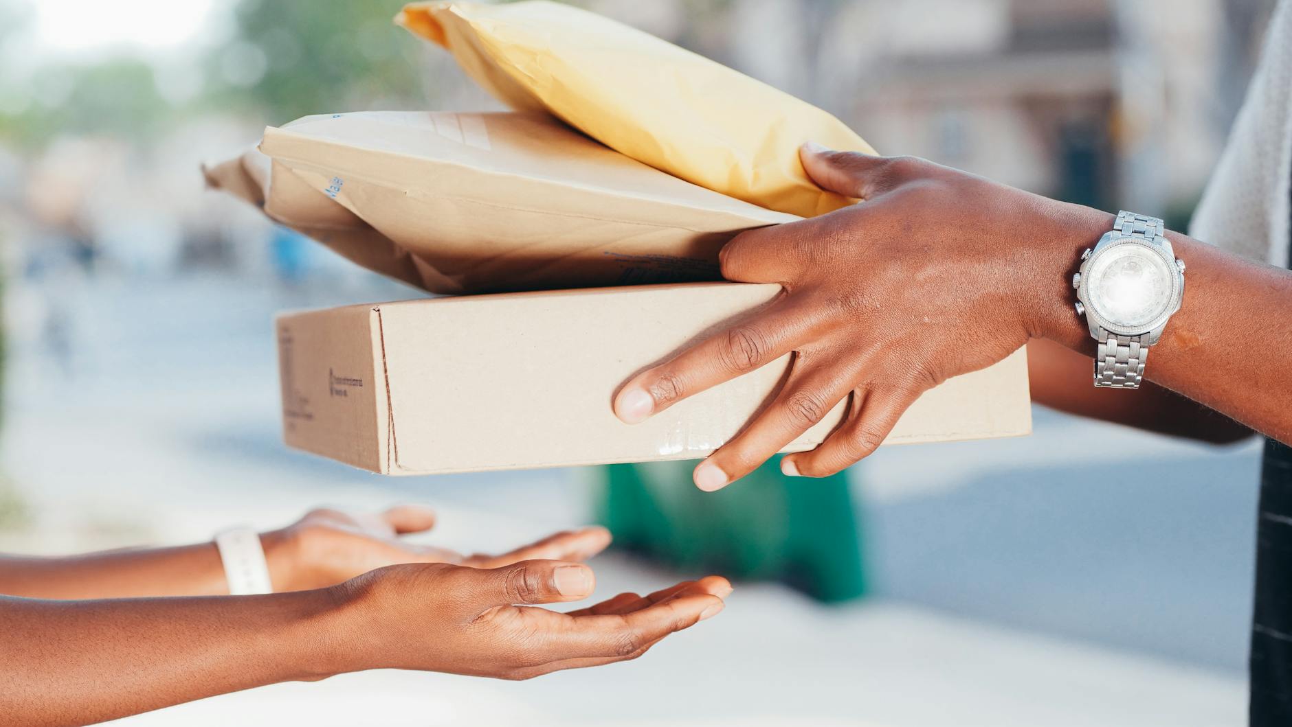 person handing over packages