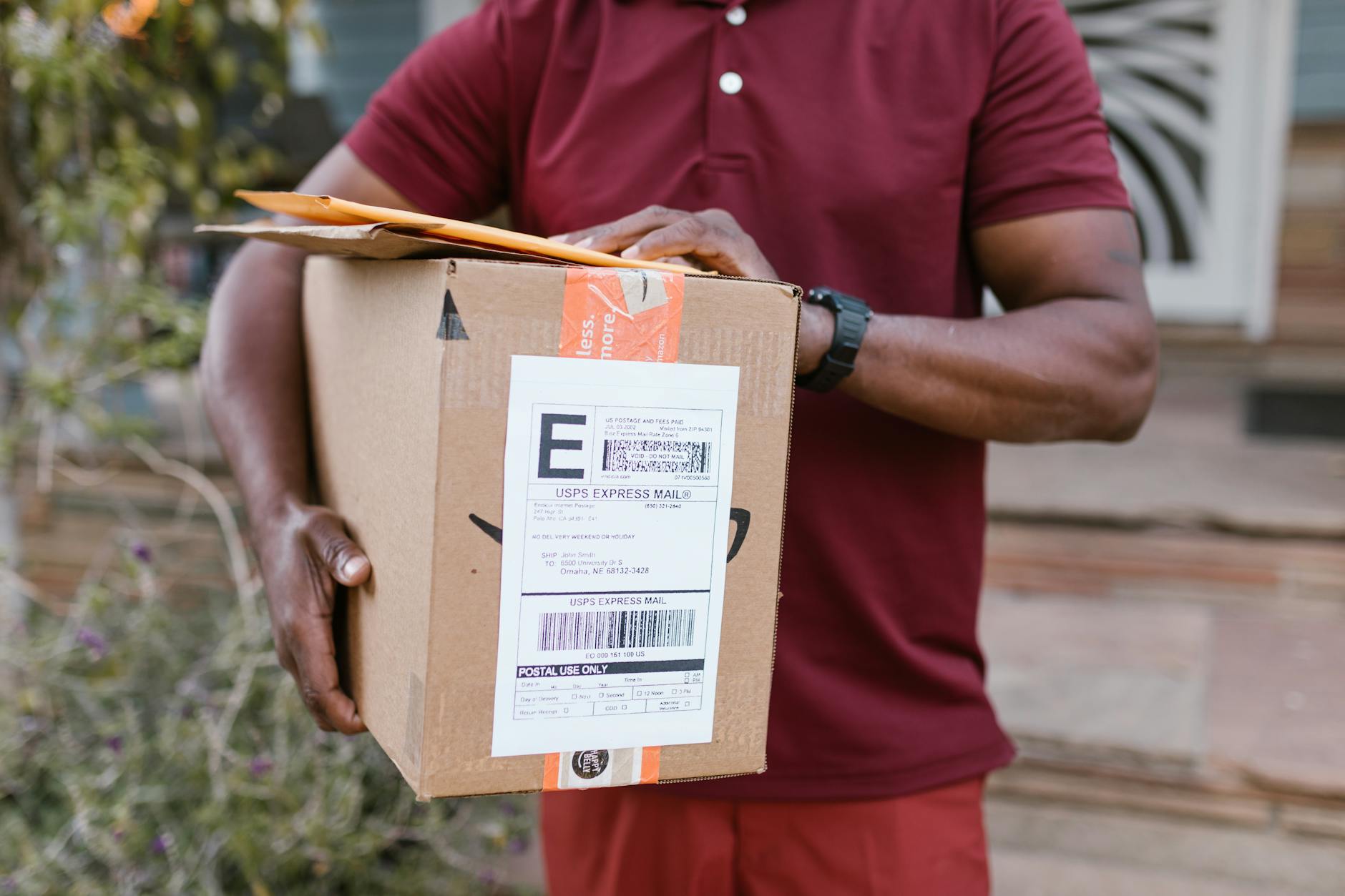 a deliveryman carrying packages