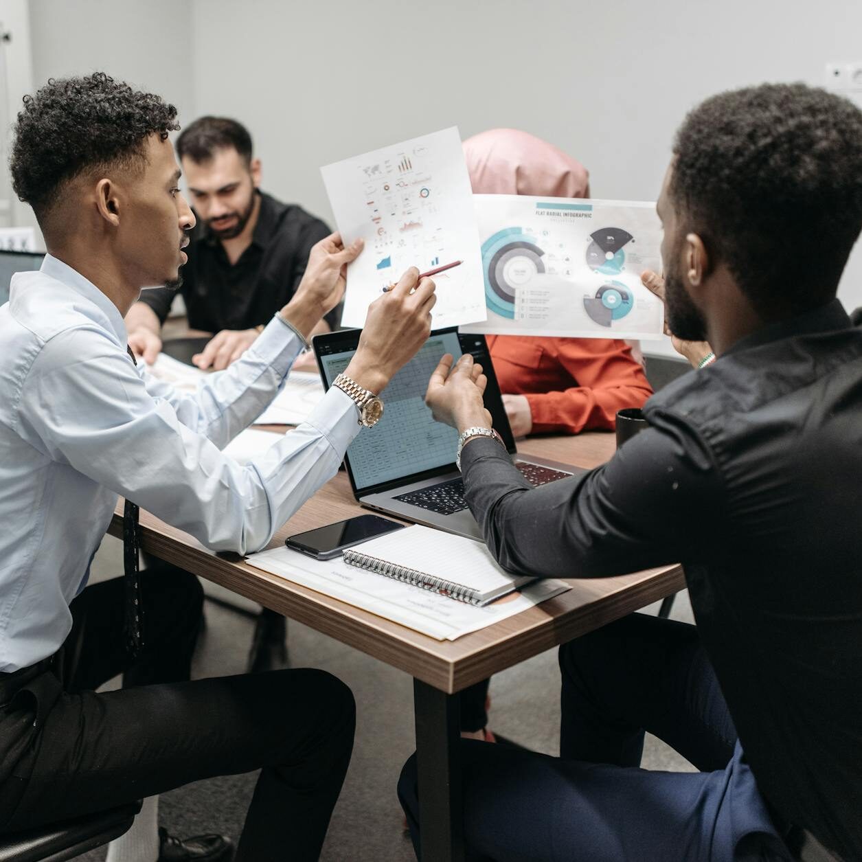 a people looking the documents together